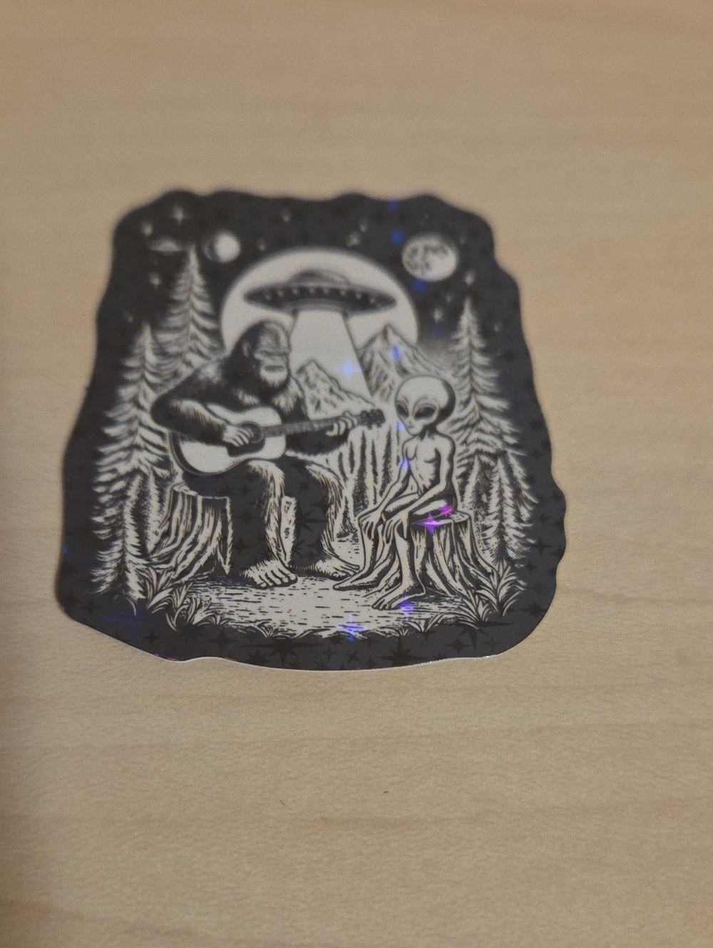 Holographic Sticker - Bigfoot and Alien Playing Guitar in Woods